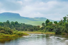 River in the Jungle. Small river in jungle. Under the cloudy sky through hills and mountains the small river proceeds on jungle. Congo. Africa